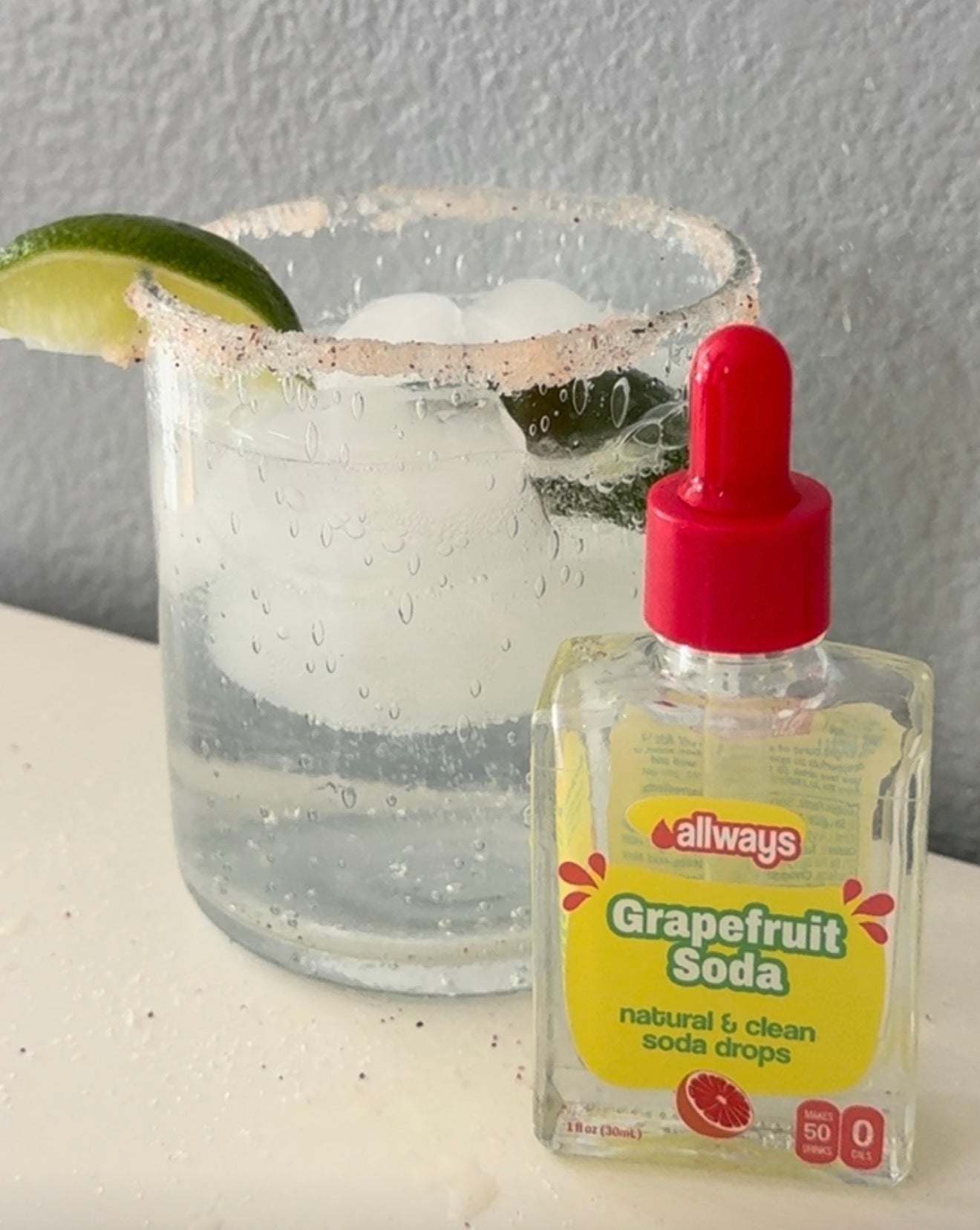 Grapefruit Paloma Mocktail with salted rim and fresh lime squeeze