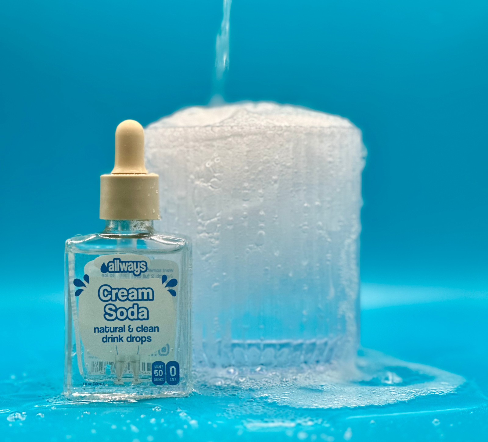 Allways Cream Soda Drops in front of a refreshing bubbly Cream Soda glass of sparkling water
