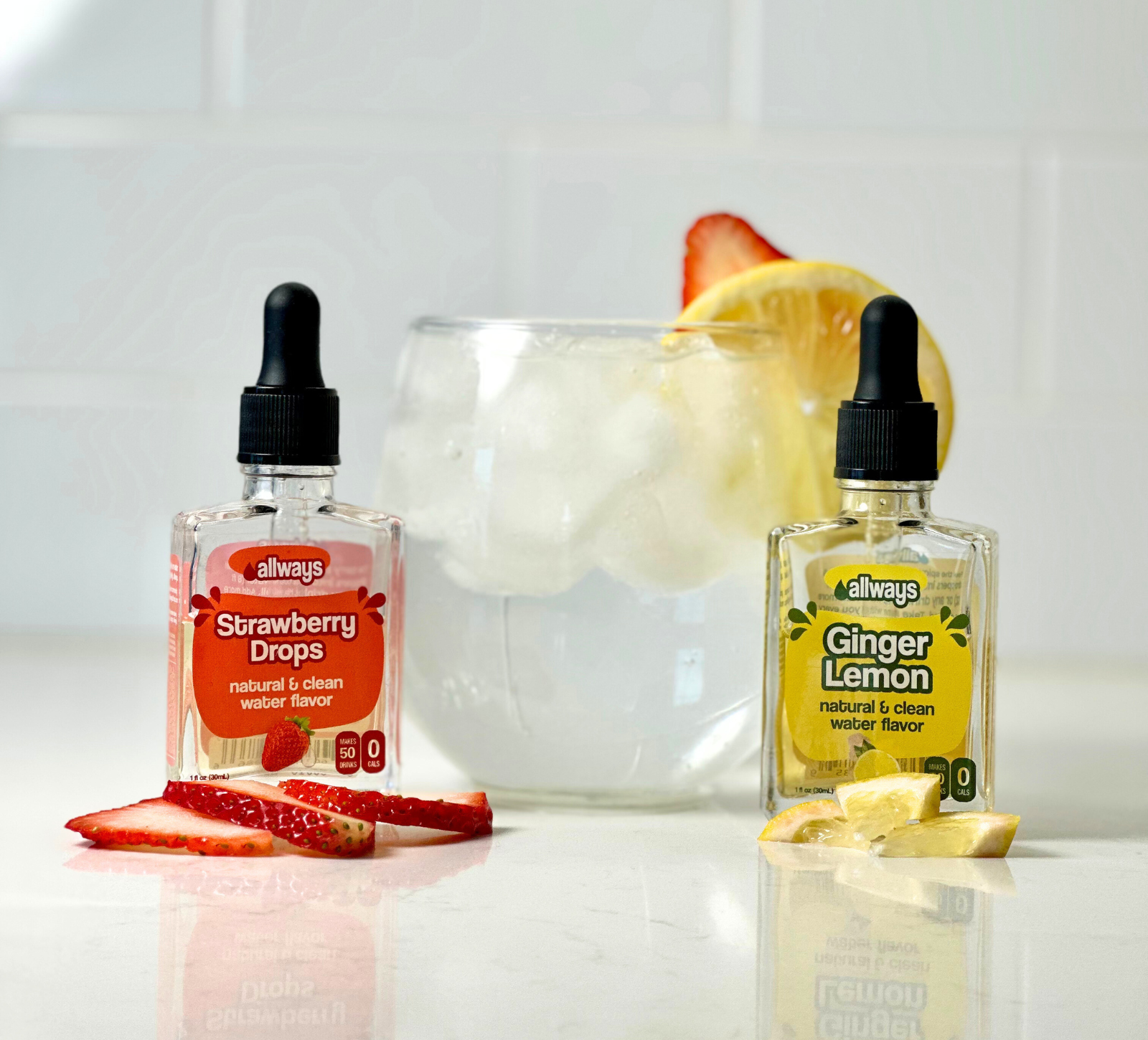 Allways Strawberry Drops and Ginger Lemon Drops in front of a refreshing strawberry lemonade drink