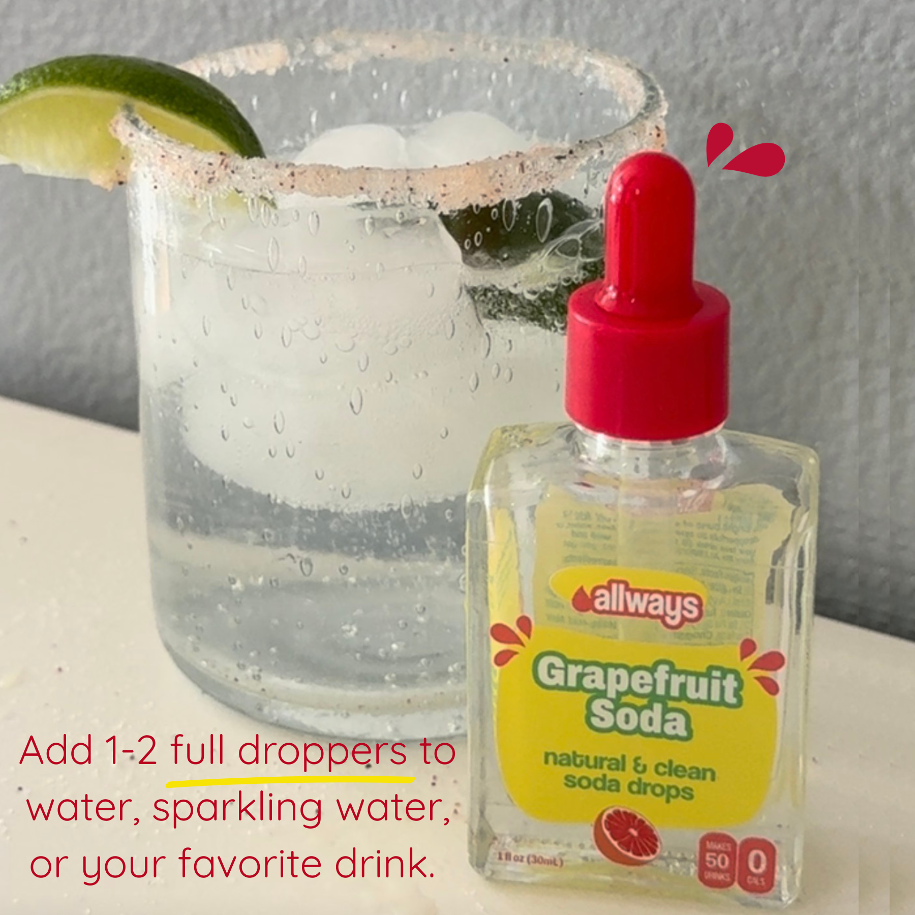Bottle of Allways Grapefruit Soda drops with a glass of sparkling water and lime.