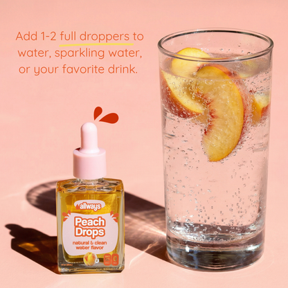 Bottle of 'Always Peach Drops' with a glass of peach-flavored drink on a pink background