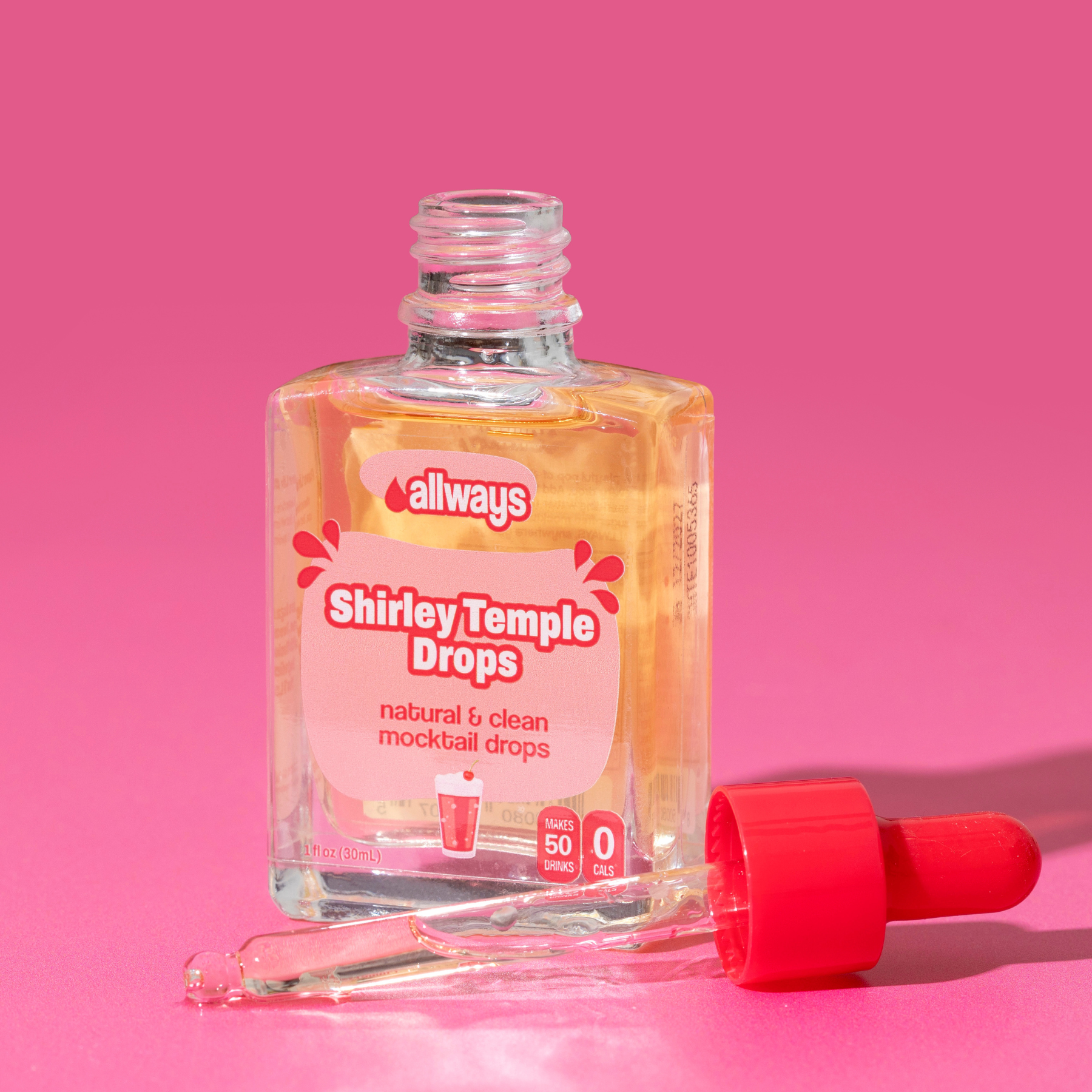 Bottle of 'Allways Shirley Temple Drops' with a dropper on a pink background
