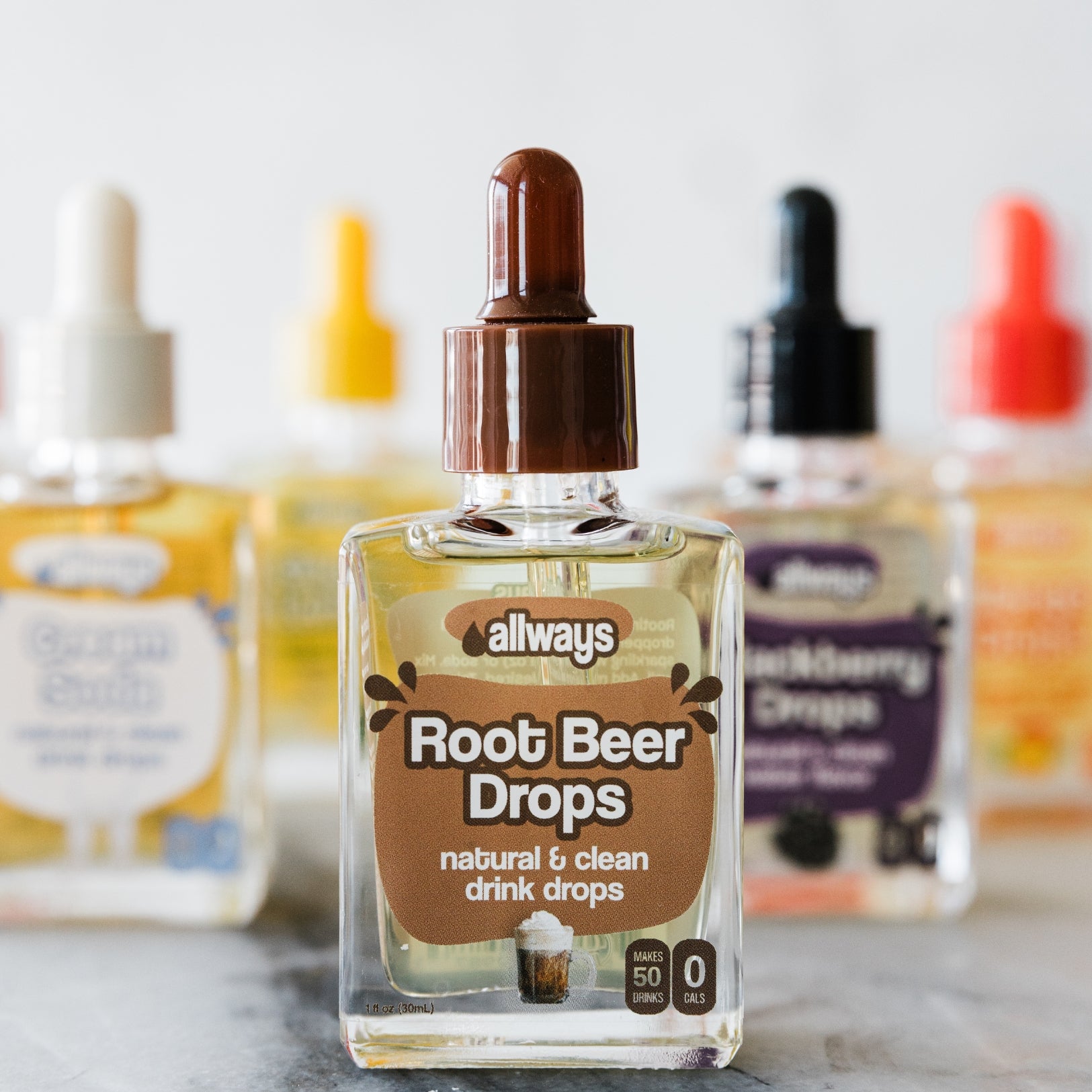 Bottle of 'Allways' Root Beer Drops with other similar products in the background.