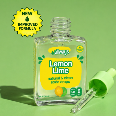 A bottle of Allways Lemon Lime natural and clean soda drops with its green dropper cap lying beside it on a light green background, featuring a yellow 'NEW IMPROVED FORMULA' badge overlay.