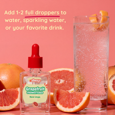 Allways Grapefruit flavor drops with a glass of pink drink and grapefruit slices on a pink background